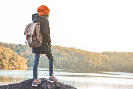 Asian girl backpack in nature winter season, Relax time on holiday concept travel,selective and soft focus,tone of hipster styleの写真素材