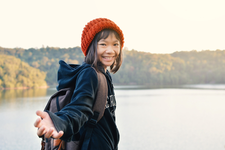 Asian girl backpack in nature winter season, Relax time on holiday concept travel,selective and soft focus,tone of hipster styleの写真素材