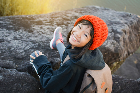 Asian girl backpack in nature winter season, Relax time on holiday concept travel,selective and soft focus,tone of hipster styleの写真素材