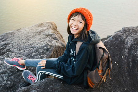 Asian girl backpack in nature winter season, Relax time on holiday concept travel,selective and soft focus,tone of hipster styleの写真素材