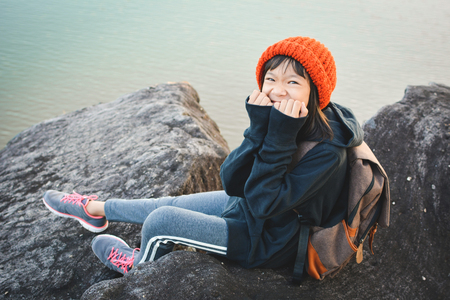Asian girl backpack in nature winter season, Relax time on holiday concept travel,selective and soft focus,tone of hipster styleの写真素材