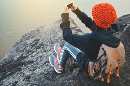 Asian girl backpack in nature winter season, Relax time on holiday concept travel,selective and soft focus,tone of hipster styleの写真素材