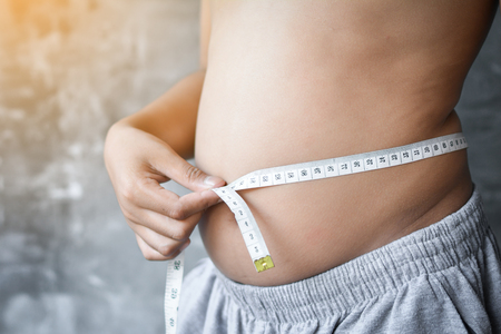 Portrait overweight Asian boy concept healthy and lose weight ,selective and soft focusの写真素材