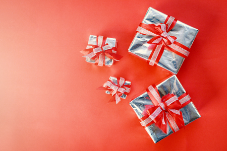 Gift box on red background for Christmas conceptの写真素材