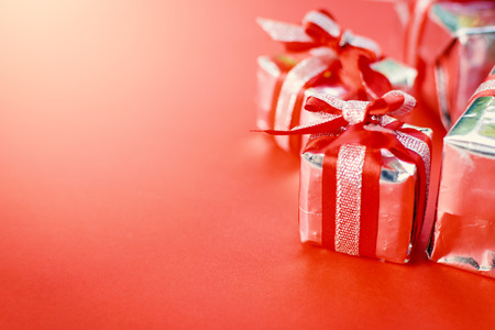 Gift box on red background for Christmas conceptの写真素材