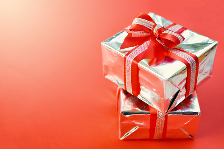 Gift box on red background for Christmas conceptの写真素材