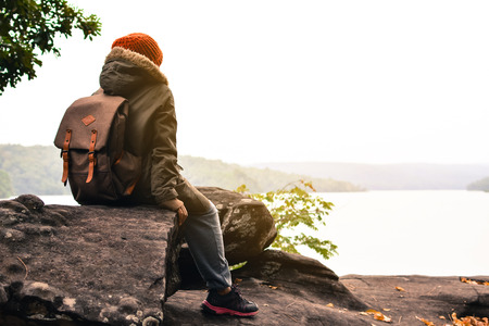 Asian boy backpack in nature winter season, Relax time on holiday concept travel,selective and soft focus,tone of hipster styleの写真素材