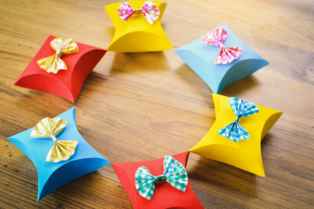 Colorful gift box paper on brown wood, Christmas and New year concept,selective and soft focusの写真素材