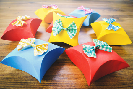 Colorful gift box paper on brown wood, Christmas and New year concept,selective and soft focusの写真素材
