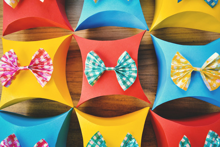 Colorful gift box paper on brown wood, Christmas and New year concept,selective and soft focus