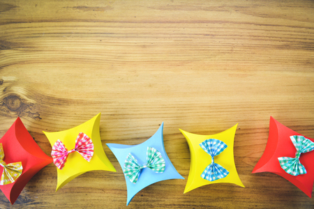 Colorful gift box paper on brown wood, Christmas and New year concept,selective and soft focusの写真素材