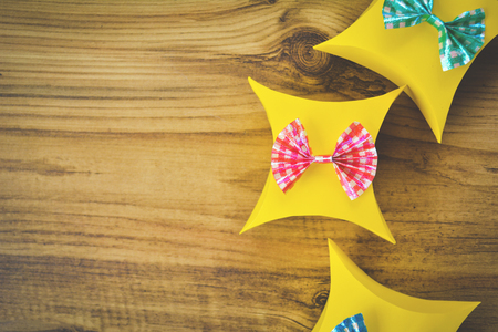 Colorful gift box paper on brown wood, Christmas and New year concept,selective and soft focusの写真素材