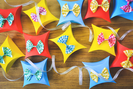Colorful gift box paper on brown wood, Christmas and New year concept,selective and soft focusの写真素材