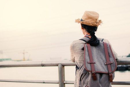 Asian women backpacker relax time on vacation hipster lifestyle, color style vintage toneの写真素材