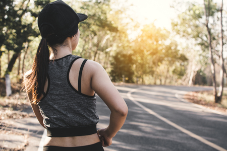 Women running on the road for health, color of vintage tone selective and soft focusの写真素材