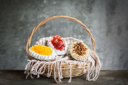 Delicious cupcake on wood table and loft backgroundの写真素材
