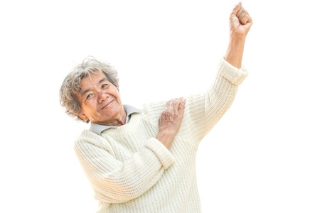 Happy Asian old woman smiling and joyful on white backgroundの写真素材