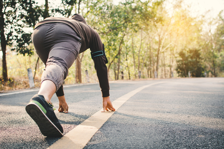 Man preparing for running on the road for health, color of vintage tone selective and soft focus