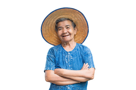 Happy old Asian woman farmer smiling on a white backgroundの写真素材