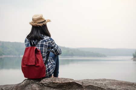 Happy Asian woman relaxing on holiday  travel concept,selective and soft focus,tone of hipster styleの写真素材