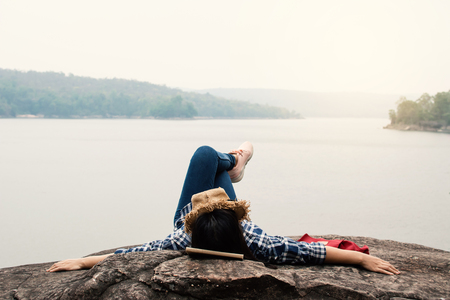 Happy Asian woman relaxing on holiday  travel concept,selective and soft focus,tone of hipster styleの写真素材