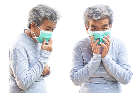 Old woman with mask coughing on white background ,Illness of the elderly problem conceptの写真素材