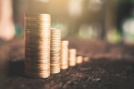 Coins on wood background,Economic growth concept.の写真素材