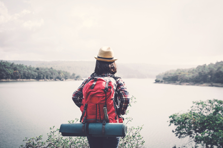 Happy Asian woman relaxing on holiday  travel concept,selective and soft focus,tone of hipster styleの写真素材