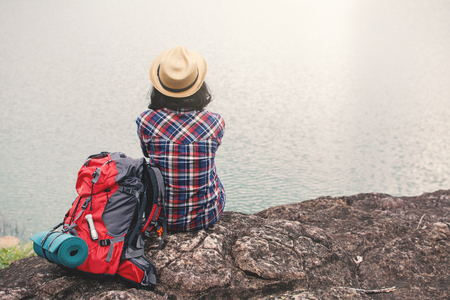 Happy Asian woman relaxing on holiday  travel concept,selective and soft focus,tone of hipster styleの写真素材
