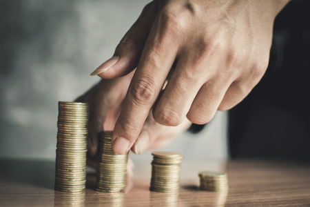Hand set money on wood, Concept save moneyの写真素材