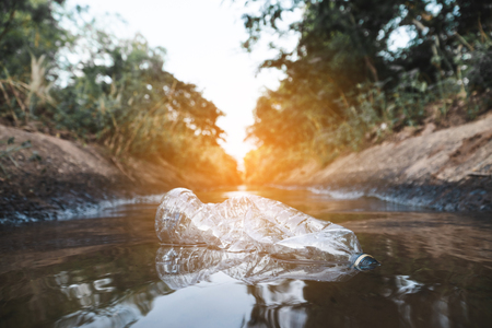 Bottle plastic in the river,environment  issue and pollution in water concept.の写真素材