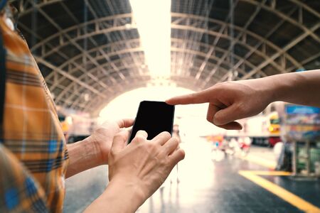 Hipster couple backpacking and searching a destination, journey on holiday concept .の写真素材