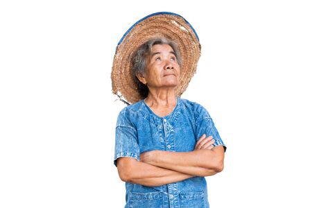 Happy old farmer woman on a white background.の写真素材