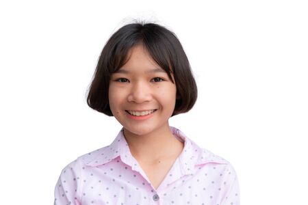 Cute Asian girl smiling on the white background.の写真素材