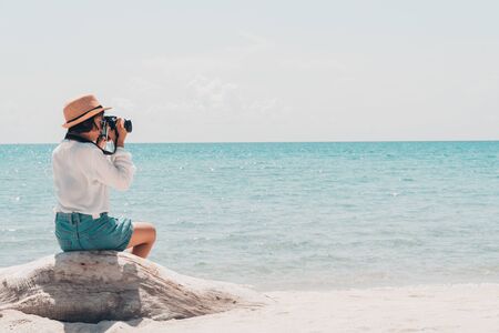 The tourist shooting in the sea on a beautiful day.の写真素材