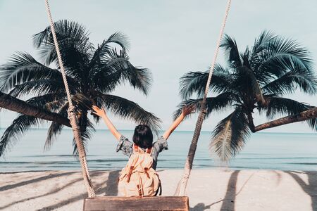 Cute girl backpack and travel on the beach.の写真素材