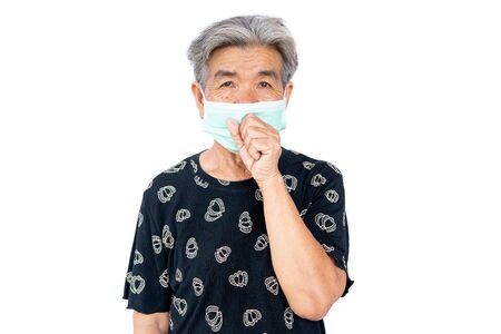 Old woman wearing a mask fear problem covid 19 and air pollution on a white background,stay at home ,healthcare concept,new normal.の写真素材