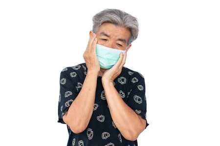 Old woman wearing a mask fear problem covid 19 and air pollution on a white background,stay at home ,healthcare concept,new normal.の写真素材