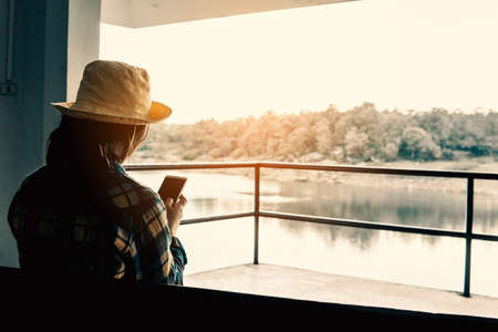 Young woman using smartphone searching for attractions on holiday.の写真素材