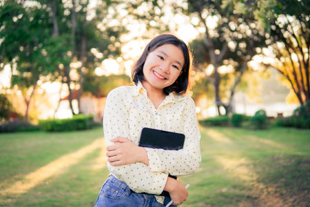 Asian female high school happy using tablet e leaning online class. selective and soft focus.の写真素材