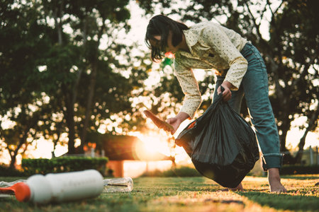 The volunteer keeping plastic and garbage on the park.の写真素材