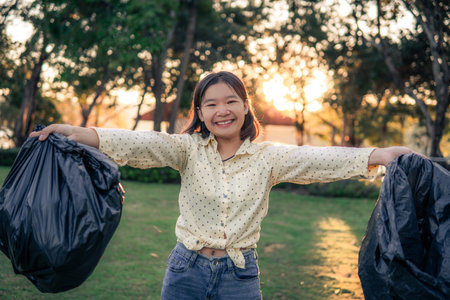 The volunteer keeping plastic and garbage on the park.の写真素材