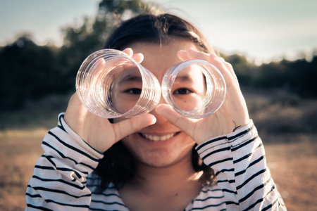 A girl holding plastic bottle, save the world from plastic conceptの写真素材