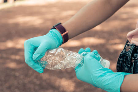 Volunteer holding plastic garbage Clean to dispose of waste properly.の写真素材