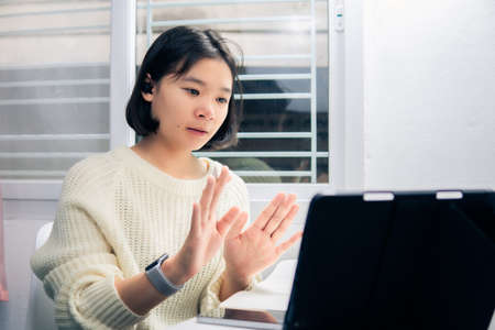 Home school Asian student learning online from lockdown epidemic.の写真素材