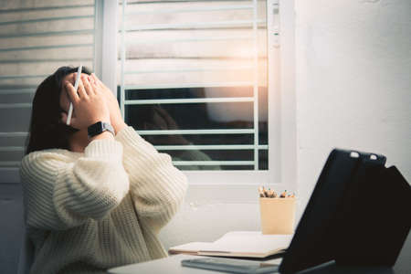 Home school Asian student learning online from lockdown epidemic.の写真素材
