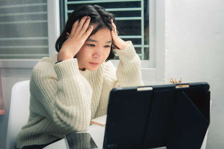 Home school Asian student learning online from lockdown epidemic.の写真素材