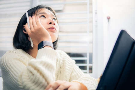 Home school Asian student learning online from lockdown epidemic.
