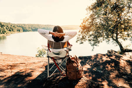 women rest on the camping chair relax time on weekend.の写真素材