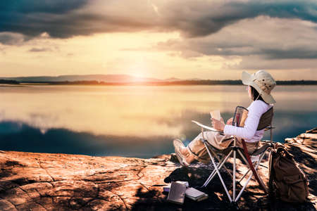women rest on the camping chair relax time on weekend.の写真素材